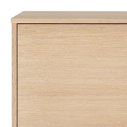 Close-up of a wooden cabinet with a light wood finish