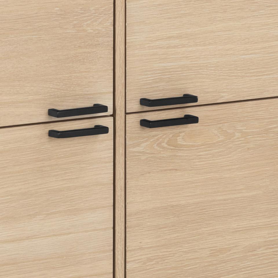 Close-up of wooden cabinets with black handles