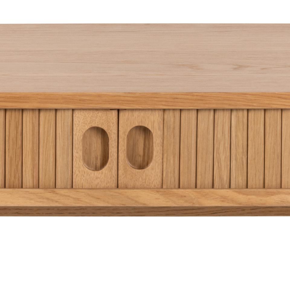 Close-up of a light natural wood furniture piece with two oval cutout details on the front, set against a white background.