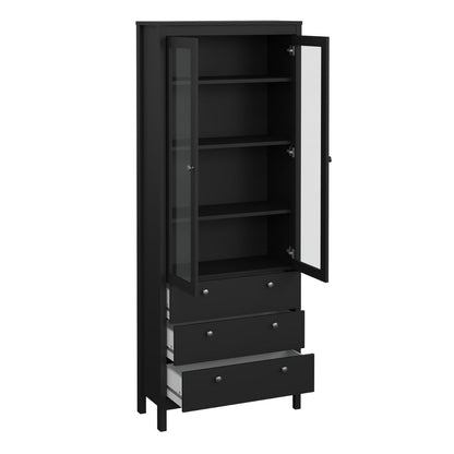 A tall black storage cabinet with a glass-front upper door, open to reveal three interior shelves, and three drawers below with small round silver knobs.