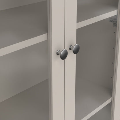 close up view of a greige cabinet with two glass doors and two metal hanles