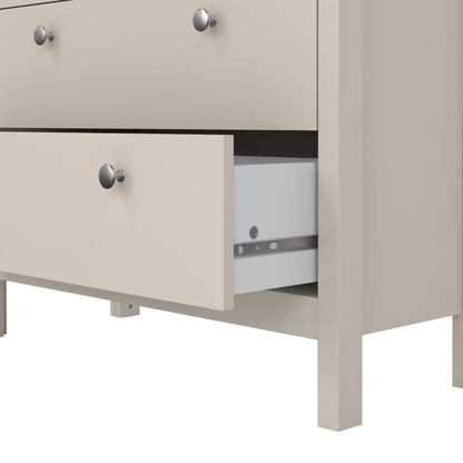 close up view of a cashmere Madrid cabinet showing the bottom of an open drawer to reveal it is white inside and has a metal runner