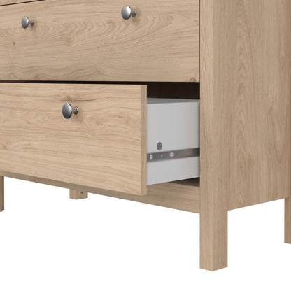 Bottom of a Madrid light oak cabinet showing an open drawer on a white background