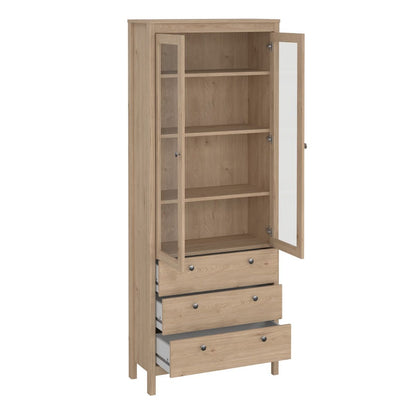 A brown light oak Madrid cabinet with two open glass doors, three open drawers and three shelves on a white background