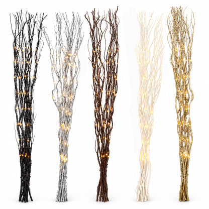 Five decorative faux tree branches bundles with warm white string lights, shown in black, silver, dark brown, cream, and metallic gold finishes against a white background.