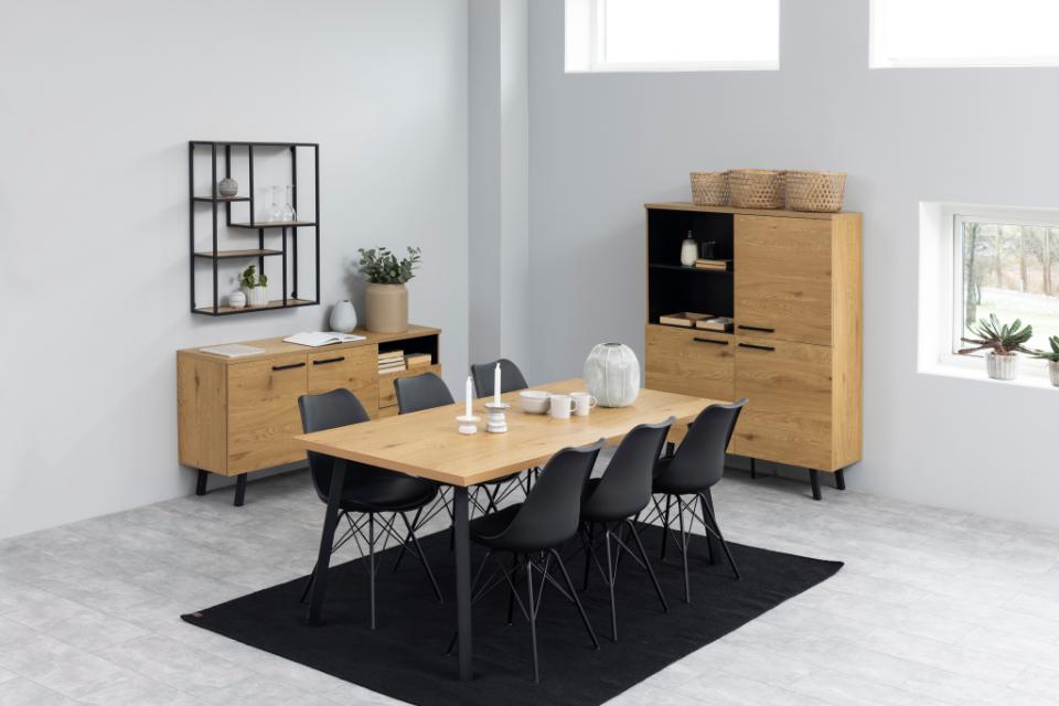 Modern dining room with wooden table and chairs in a minimalistic setting