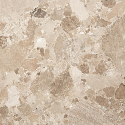 Close-up of a beige marble tile with a speckled pattern