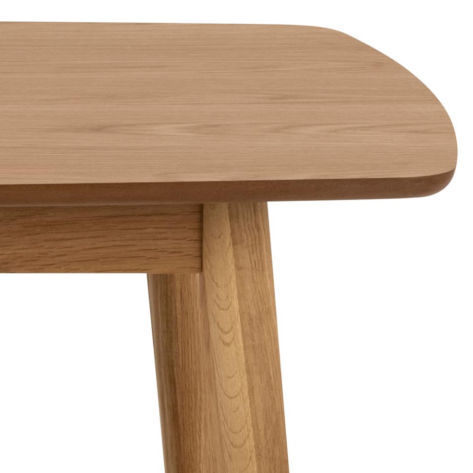 Close-up of a wooden table with a white background