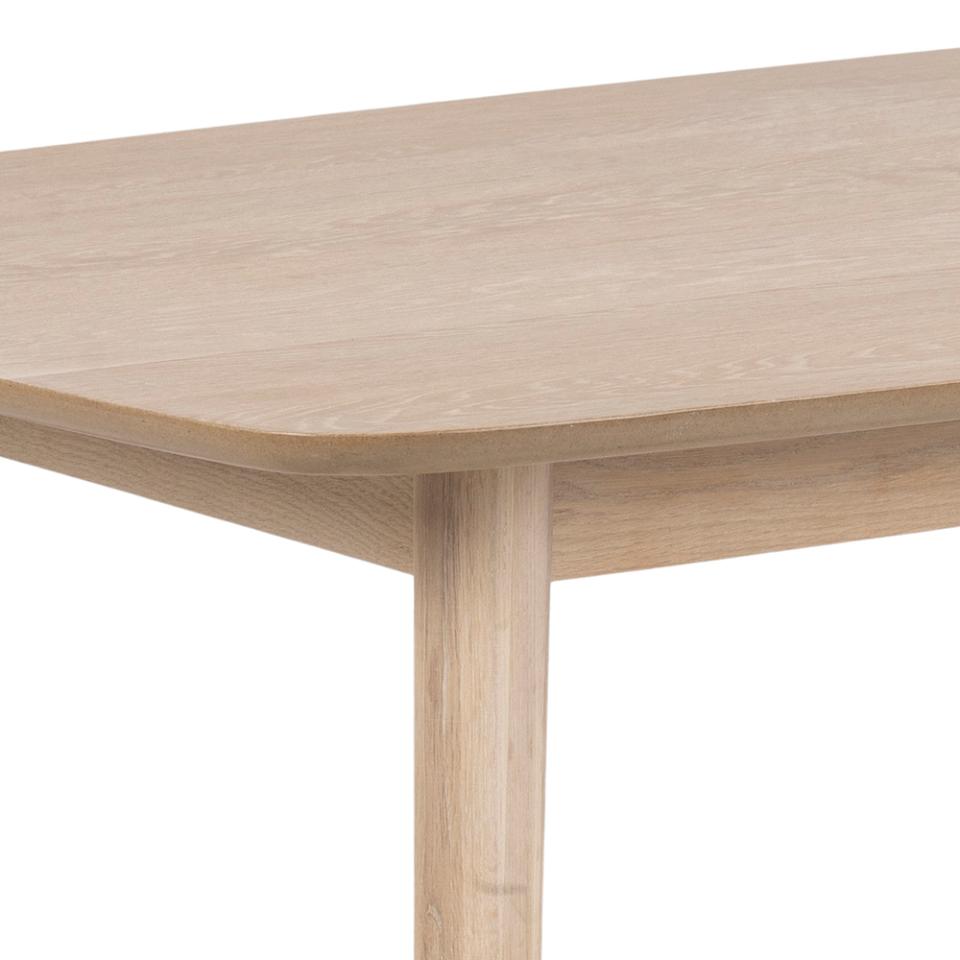 Wooden table with a light finish on a white background