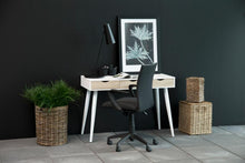 Load image into Gallery viewer, Modern home office with a desk, chair, and decorative items against a dark wall.
