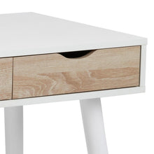 Load image into Gallery viewer, Close-up of a modern desk featuring a white top and legs with a light natural wood drawer front and a black pull handle.
