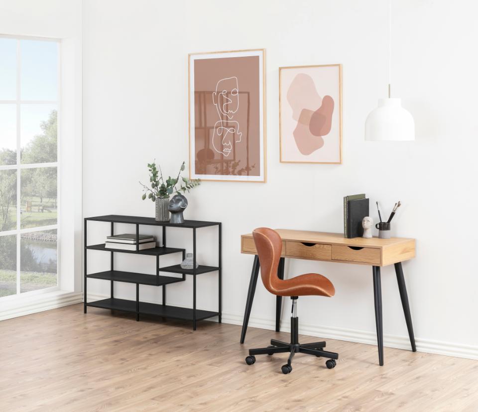 Modern office setup with a desk, chair, and shelves in a bright room.