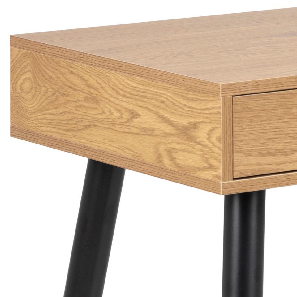 Wooden desk with a drawer and black legs on a white background