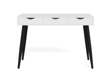 Load image into Gallery viewer, A modern writing desk with a white rectangular top, three drawers with black pull handles, and four tapered black legs, shown on a white background.
