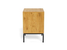 Load image into Gallery viewer, A modern wooden side table or cabinet with a light oak wood grain finish and a black metal frame base, shown against a plain white background.
