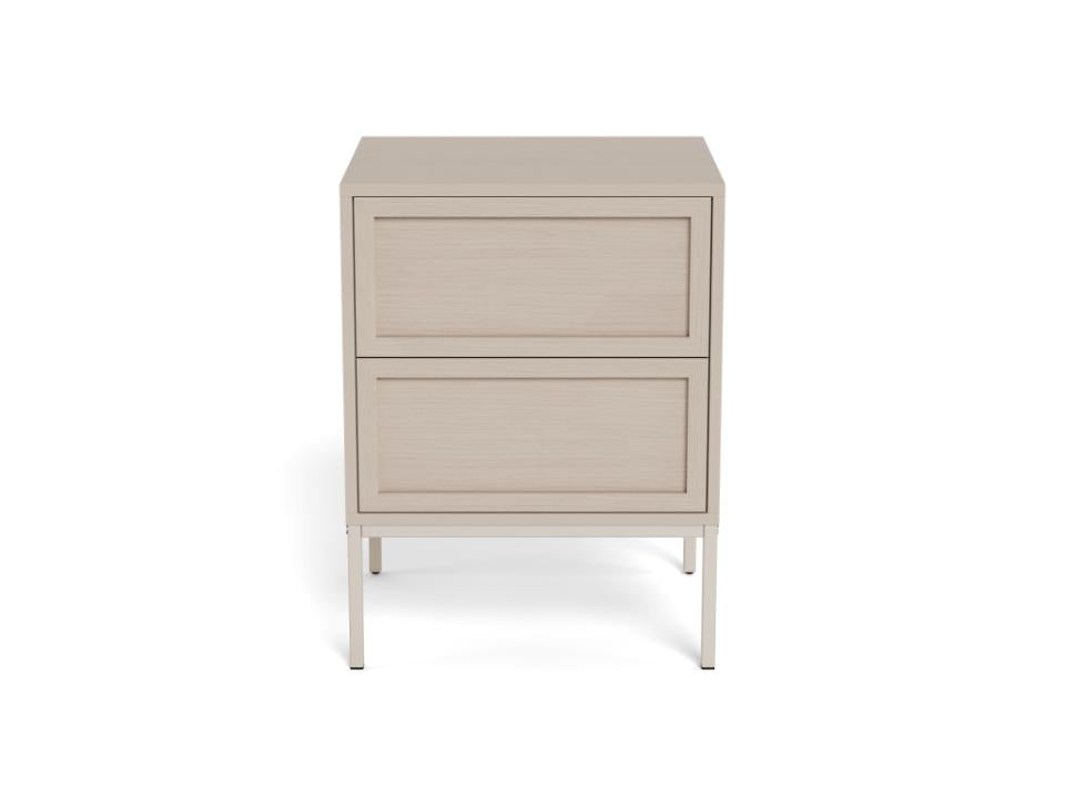 A modern two-drawer nightstand with a light beige wood-grain finish and slim silver metal legs, shown against a plain white background.