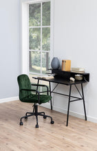 Load image into Gallery viewer, A modern black writing desk with open shelving, styled with books and a vase in a bright room with light wood floors and a green velvet office chair.
