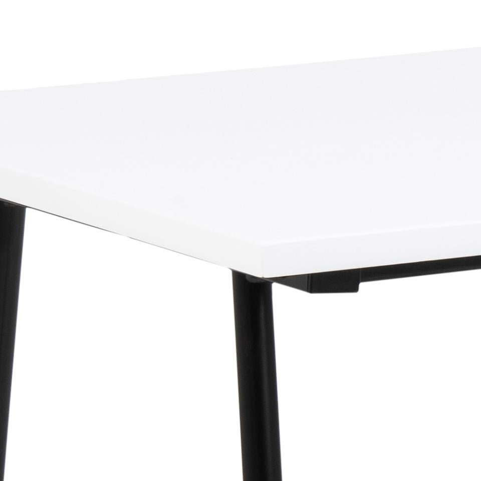 Close-up of a white rectangular office desk top with black metal legs on a white background.