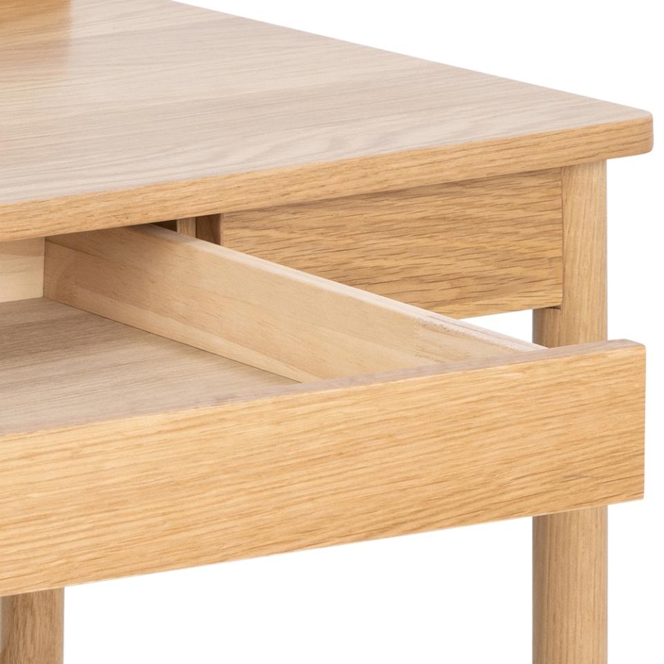 Close-up of a light oak wood table or desk drawer with the front pull handle extended outward, showing the natural wood grain and clean white background.