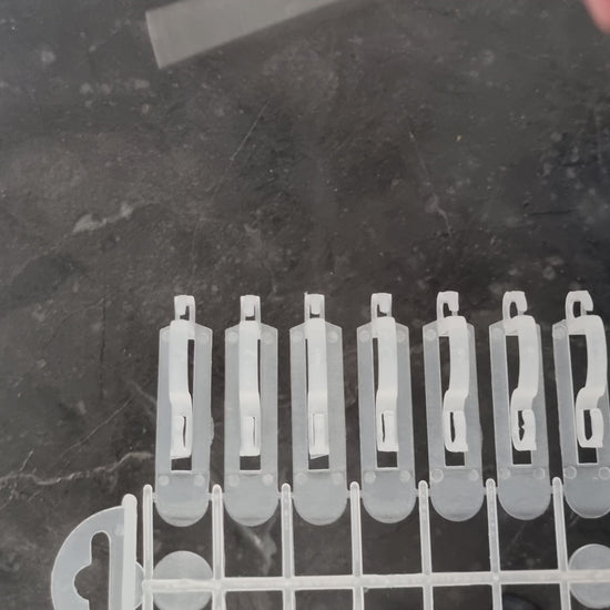 video of light hooks being taken from packaging