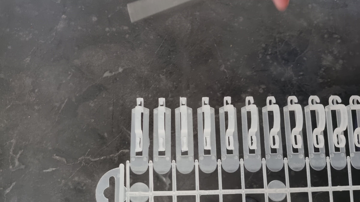 video of light hooks being taken from packaging