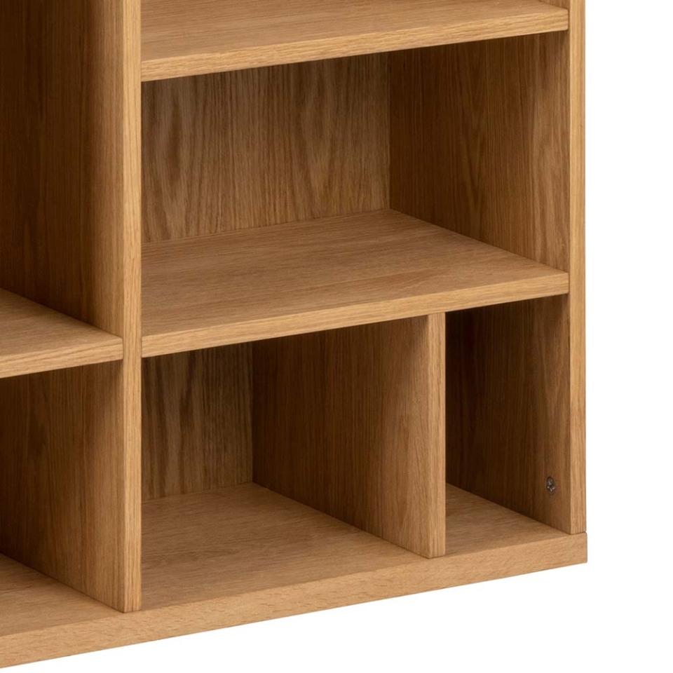 Wooden bookshelf with multiple shelves on a white background