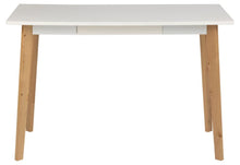 Load image into Gallery viewer, A modern writing desk with a white rectangular top, three white drawer fronts, and four tapered natural wood legs, shown against a plain white background.
