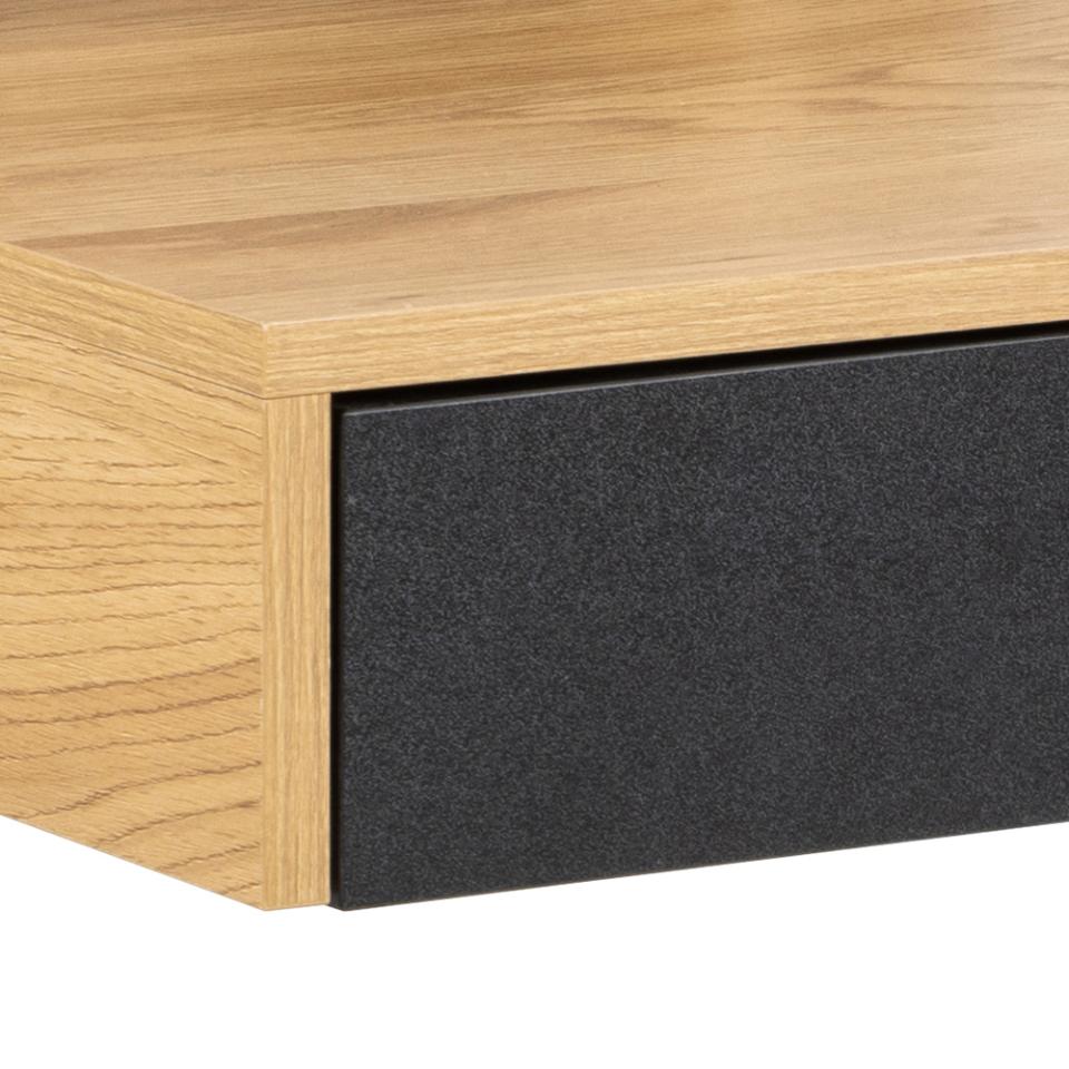 Close-up of a wooden furniture piece with a black drawer.