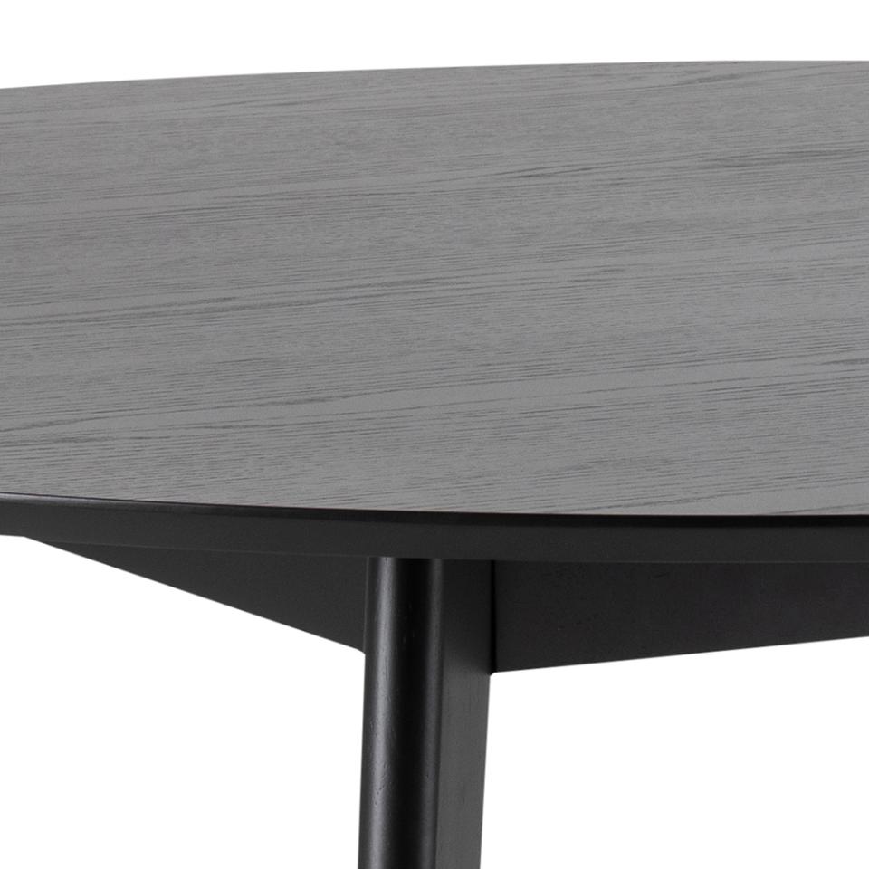 Close-up of a round gray table with a black metal leg on a white background