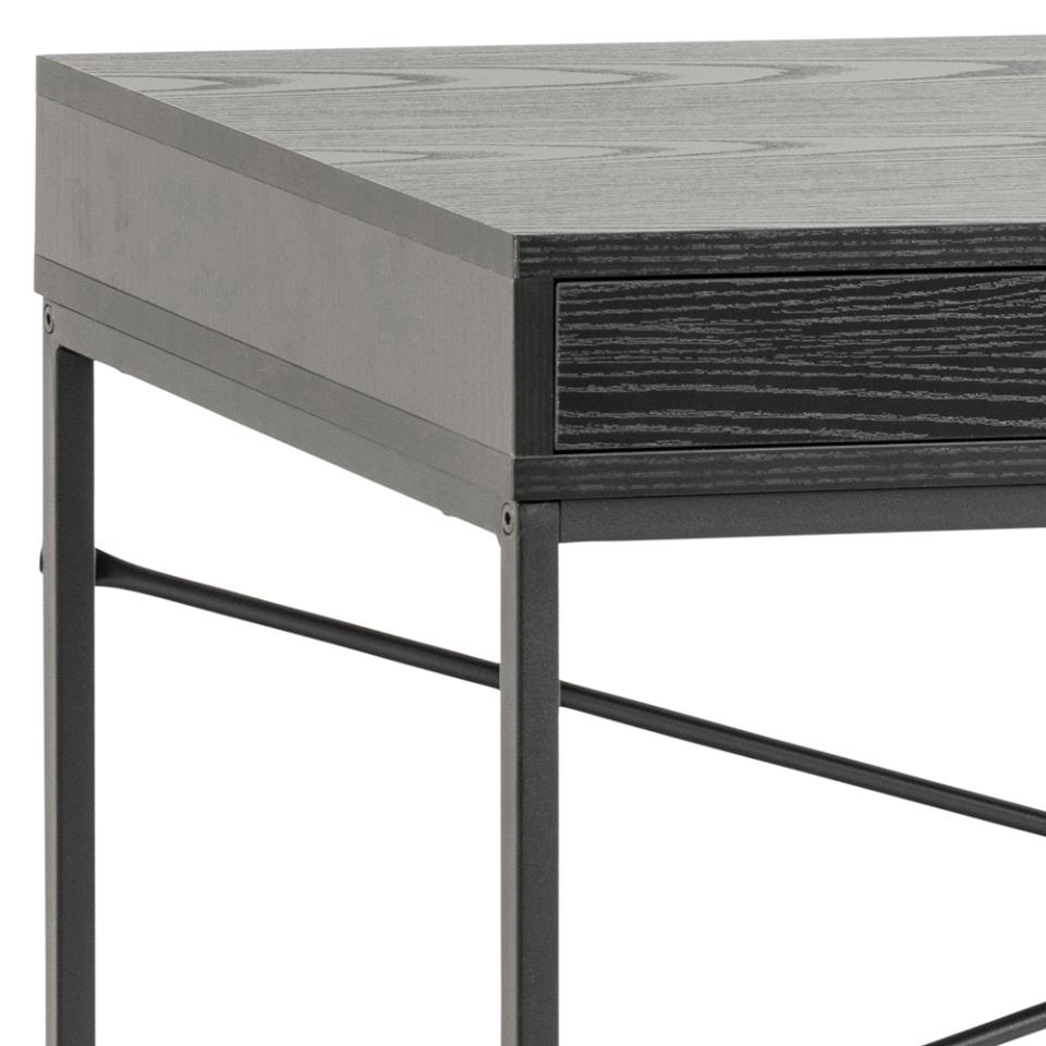 Close-up of a modern desk or console table corner showing a black wood-grain top, a dark drawer front, and a black metal frame leg on a white background.