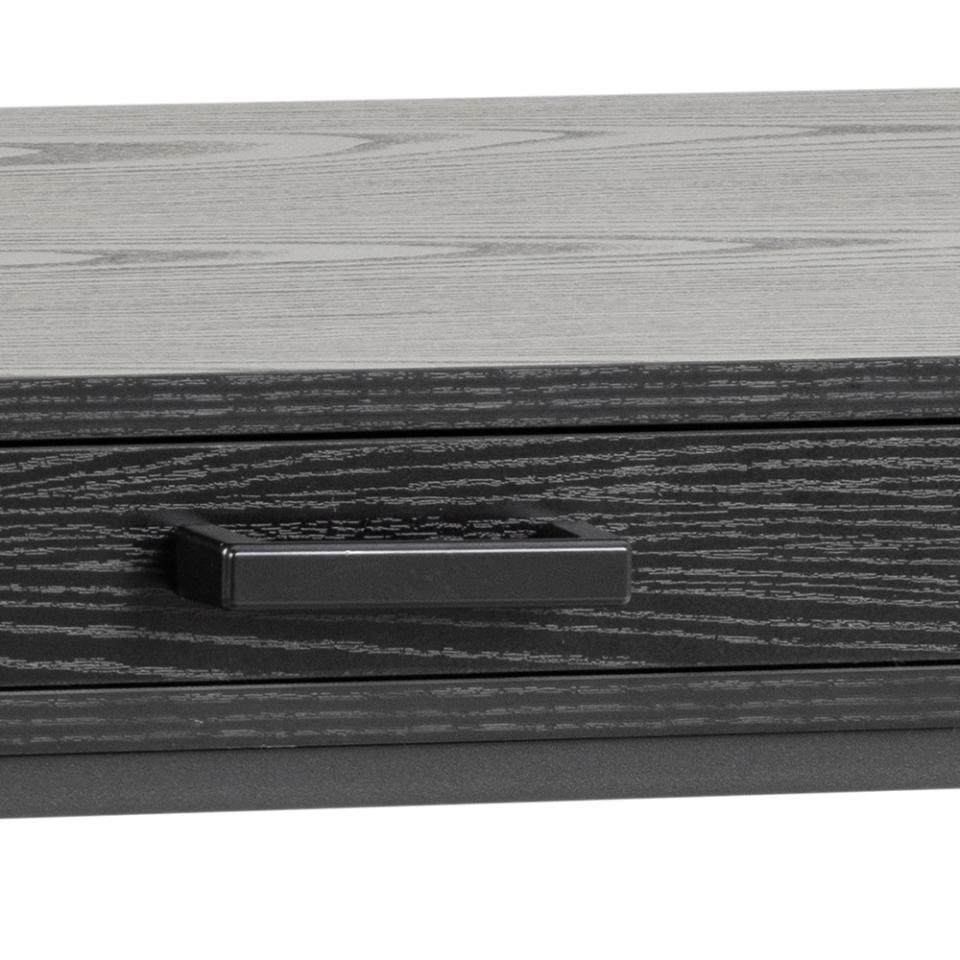 Close-up of a wooden drawer with a black handle on a white background