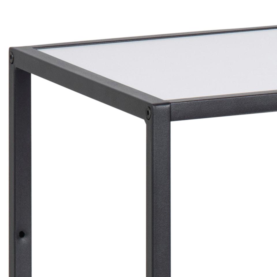 Close-up of a modern table corner showing a dark charcoal metal frame and a white tabletop against a white background.