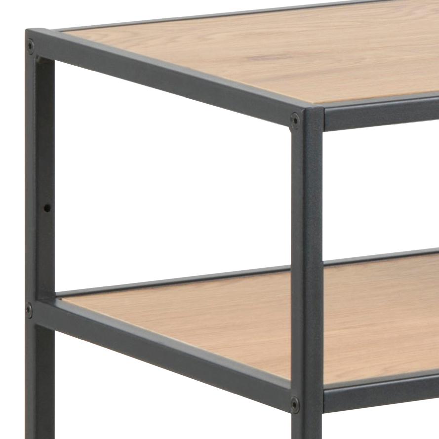 Two-tiered metal and wood shelf with a white background