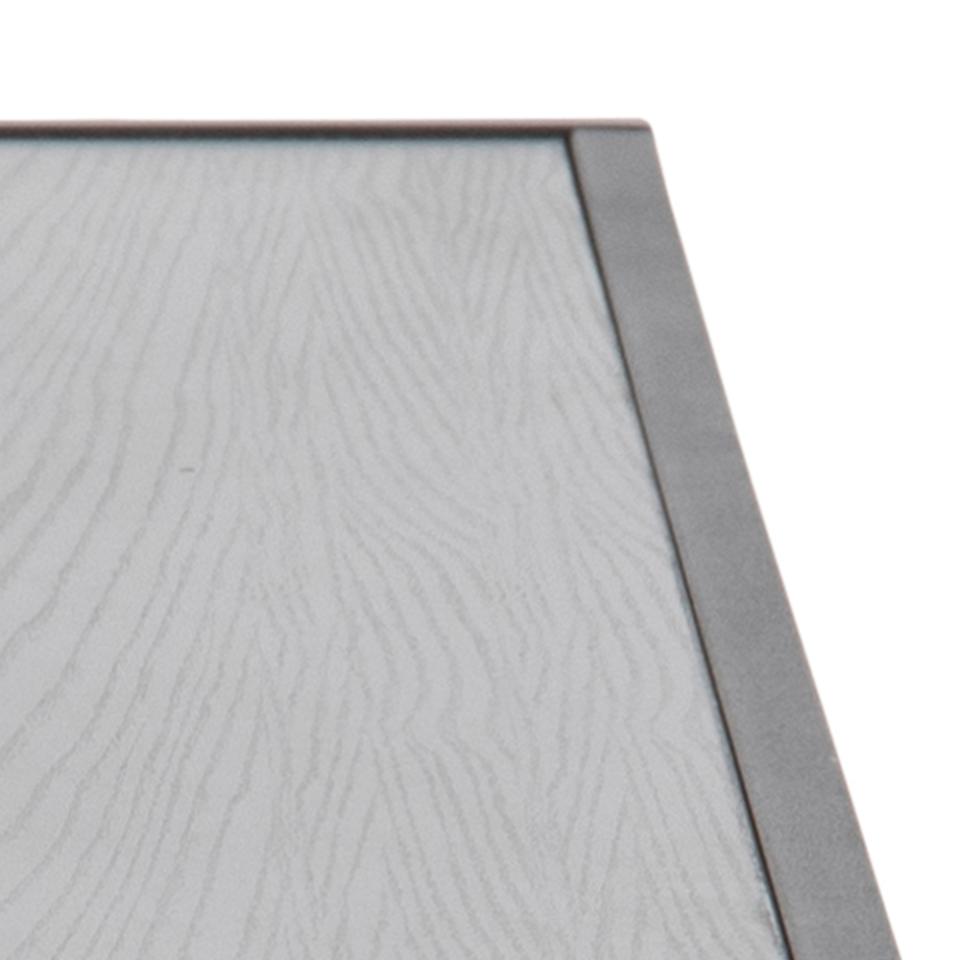 Close-up of a textured gray surface with a metallic frame.