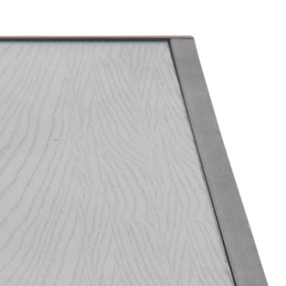 Close-up of a textured gray surface with a metallic frame.