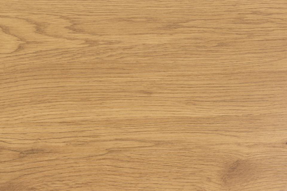 A close-up view of a light oak wood grain texture, showing natural patterns and tones.
