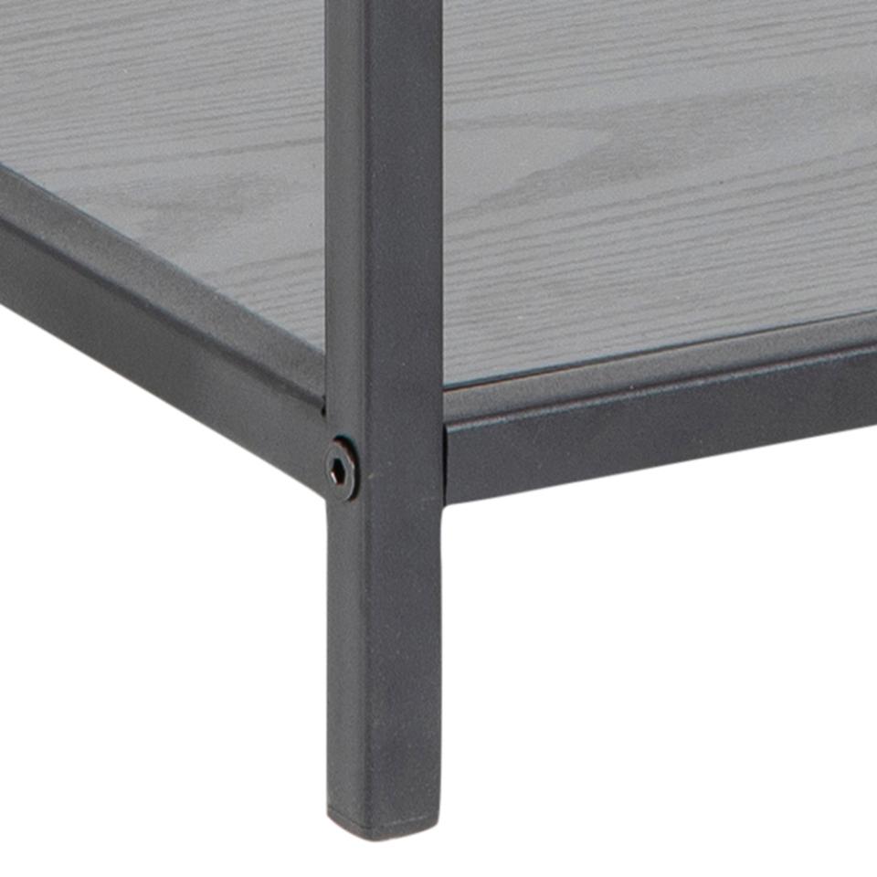 Close-up of a metal table leg with a gray top on a white background
