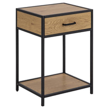 Load image into Gallery viewer, A modern two-tier side table featuring a black metal frame and light brown wood-grain finish on the drawer front, top shelf, and tabletop, with a single black metal drawer handle.
