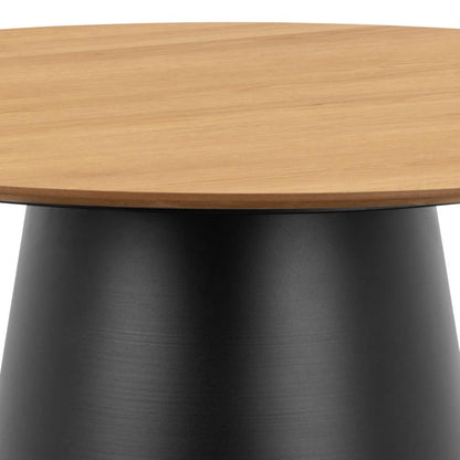Close-up of a round table showing a light natural wood tabletop and a matte black tapered pedestal base against a white background.