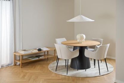 Modern dining room with round table and chairs, TV stand, and pendant light.