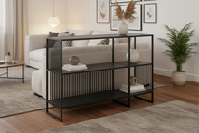 Load image into Gallery viewer, Black metal console table with open shelves on a white background
