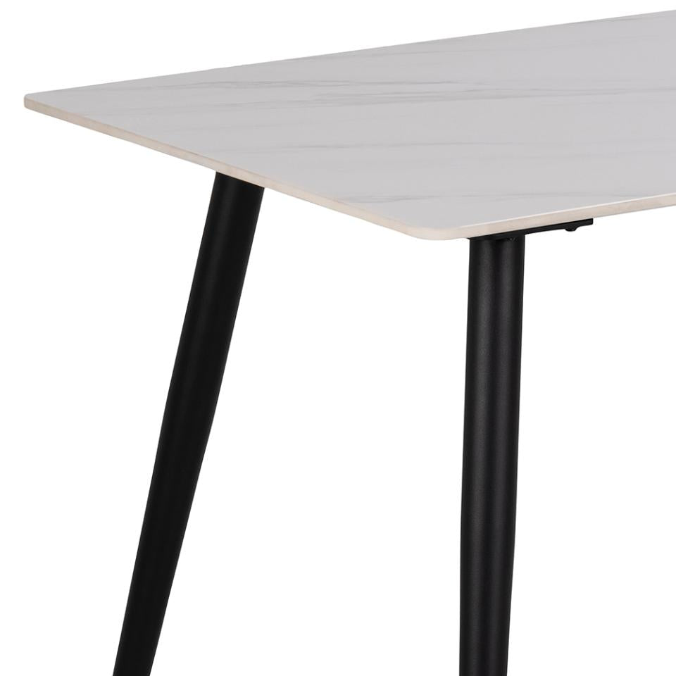 White table with black legs on a white background