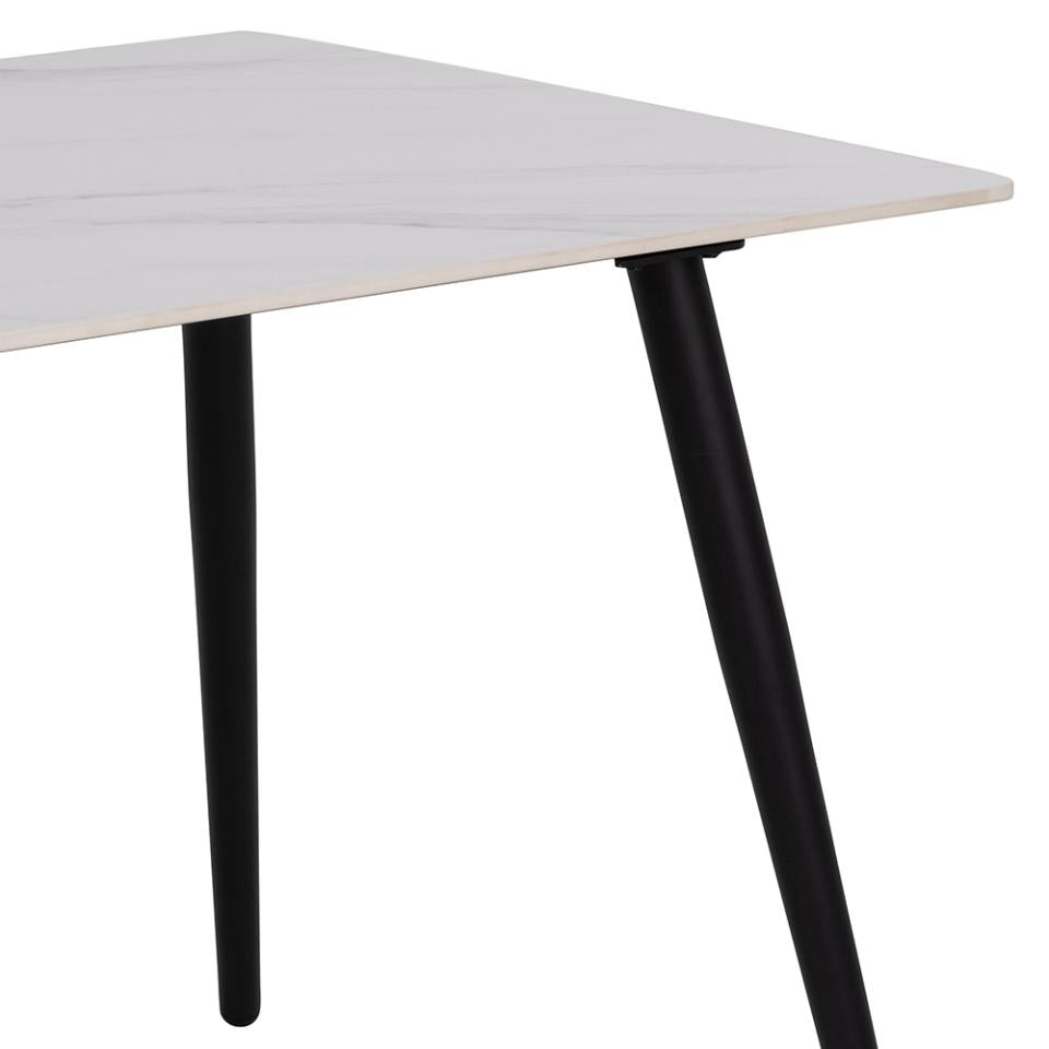 White table with black legs on a white background