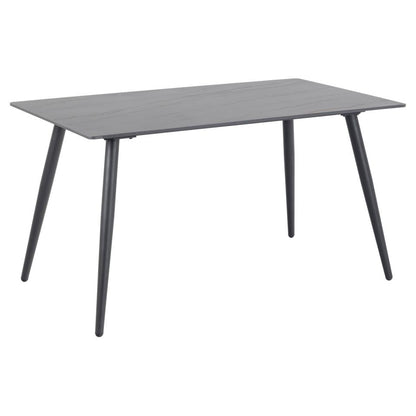 A rectangular black ceramic dining table with a marble print top and black metal base.