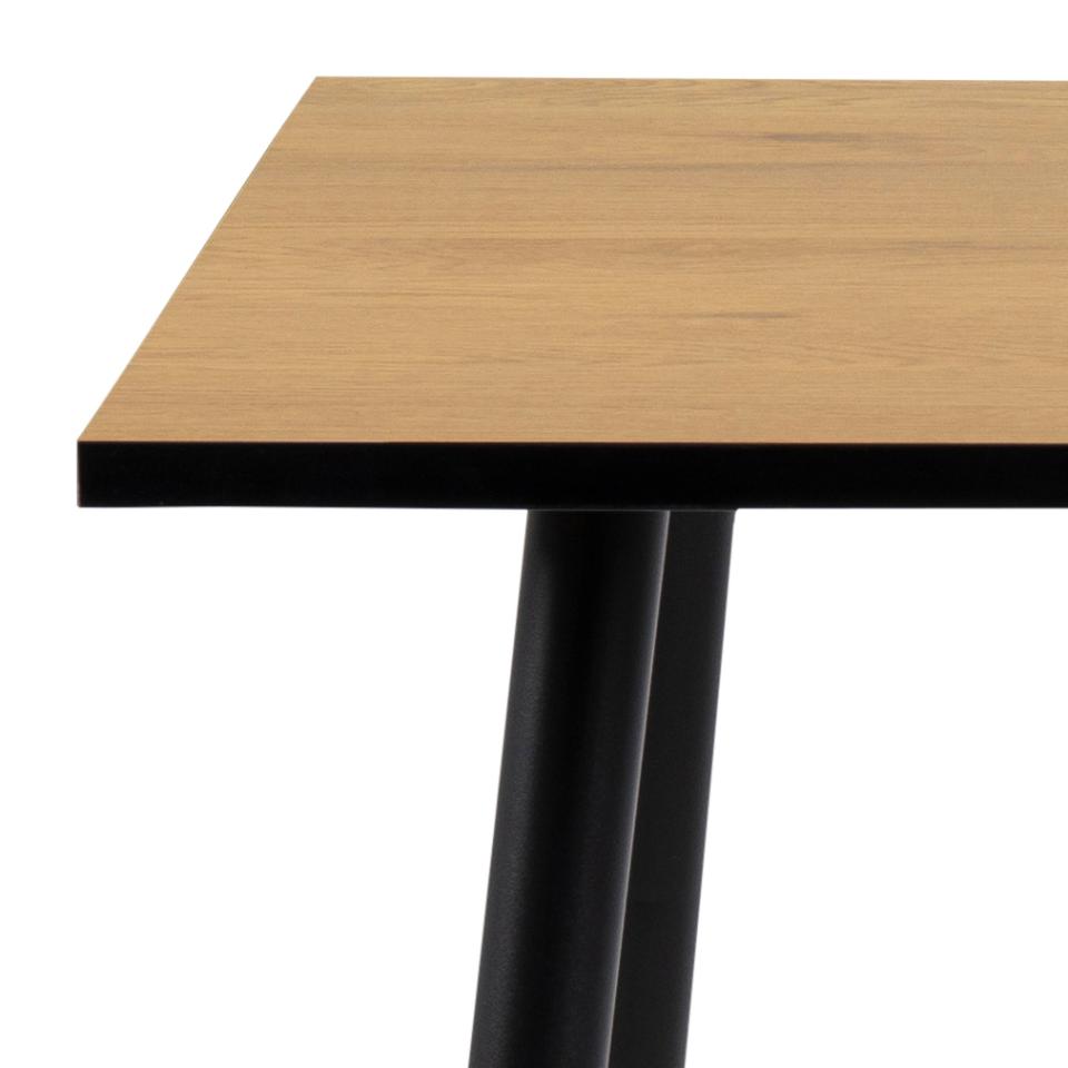 Wooden table top with black metal legs on a white background