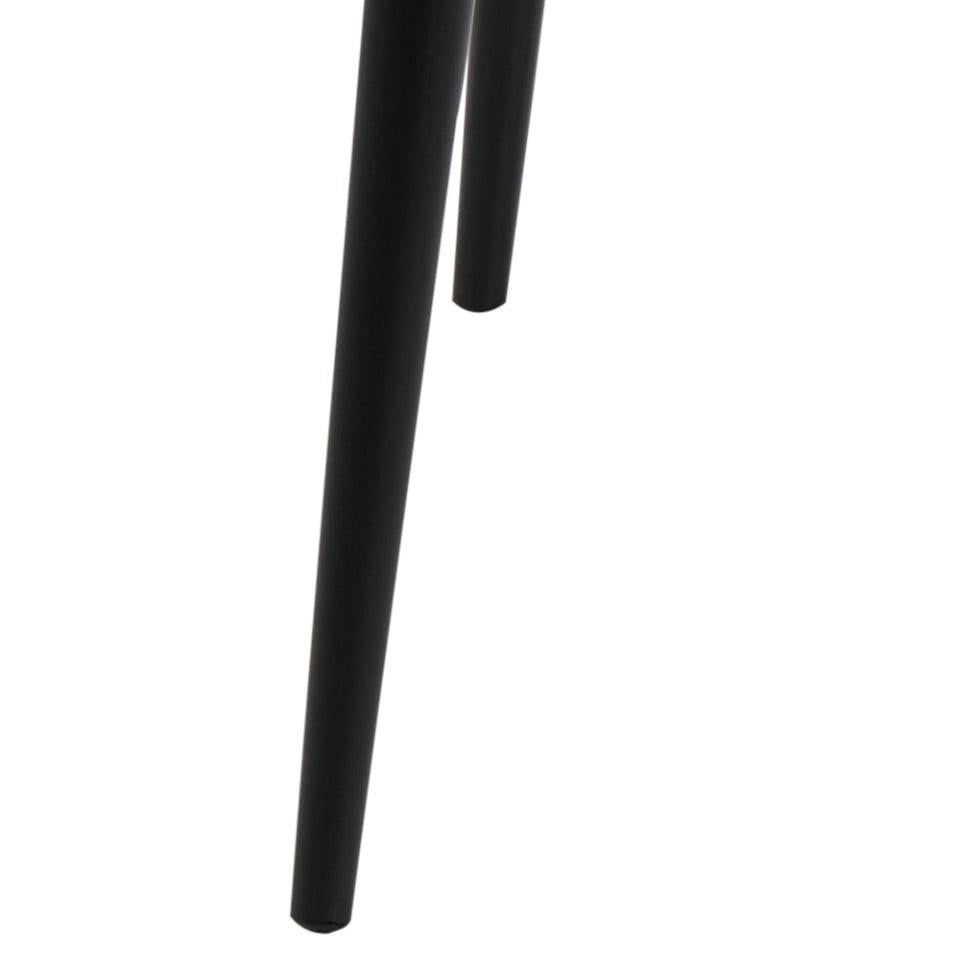 Close-up of a black metal leg on a white background