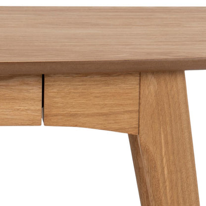 Close-up of a wooden desk with a white background