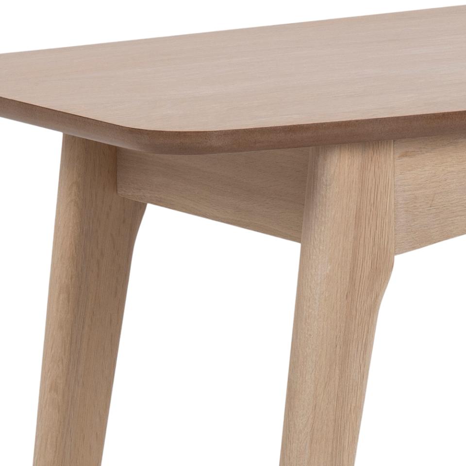 Wooden table with a light finish on a white background