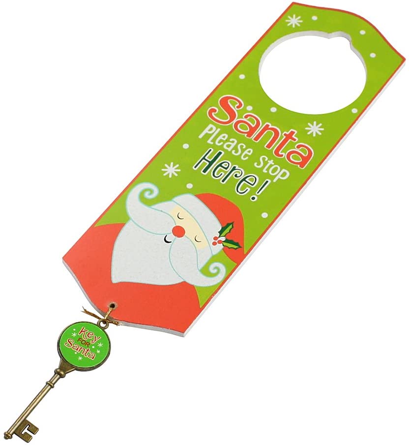 A green door hanger with a 'Santa Please Stop Here' message, featuring a cartoon image of Santa Claus, a Christmas tree, and holiday-themed decorations.