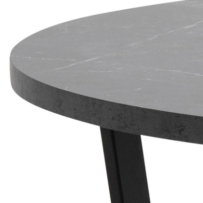 close up of an Amble dining table top and leg on a white background